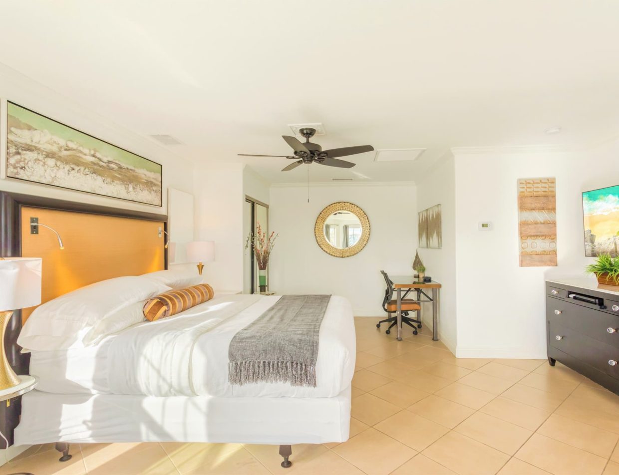 Avila Suite king bed with garden and hillside views at Villa Inn in Temecula Wine Country
