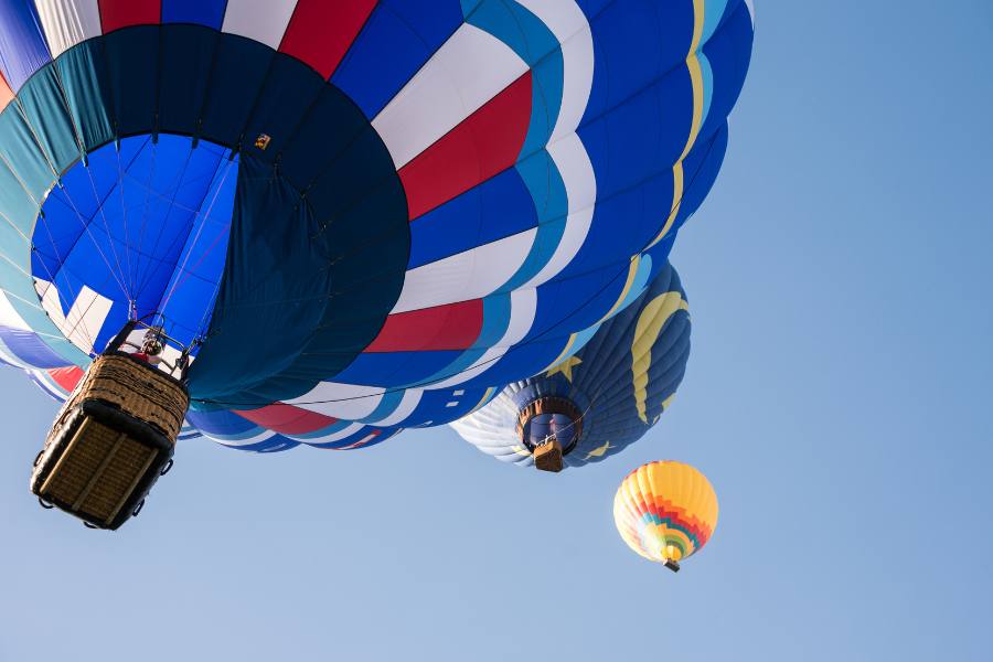Hot air balloons against a blue sky at the Temecula Valley Balloon and Wine Festival