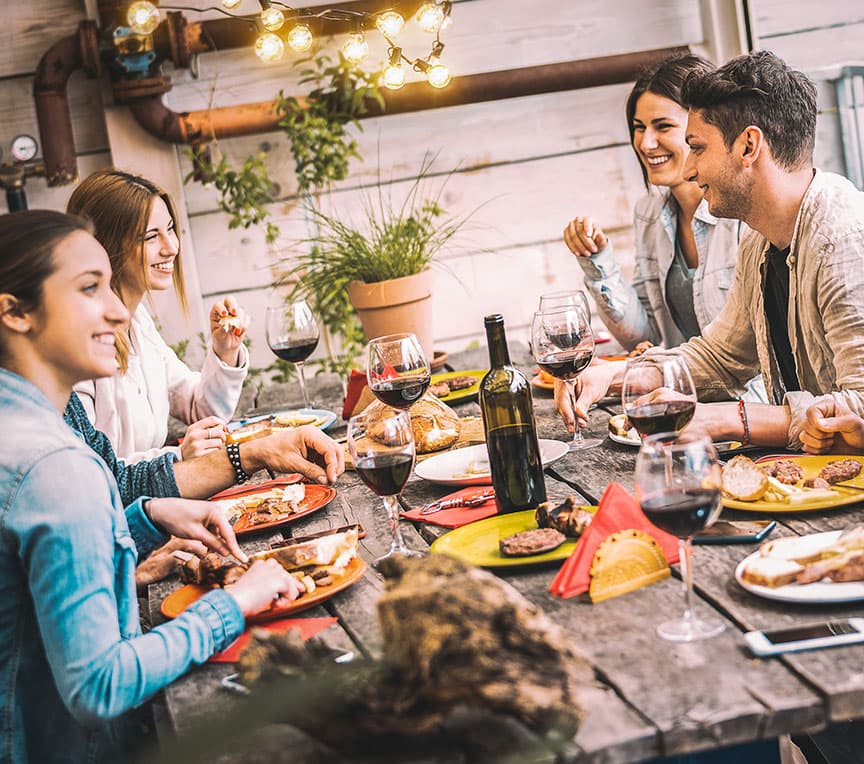 friends having dinner together at a restaurant