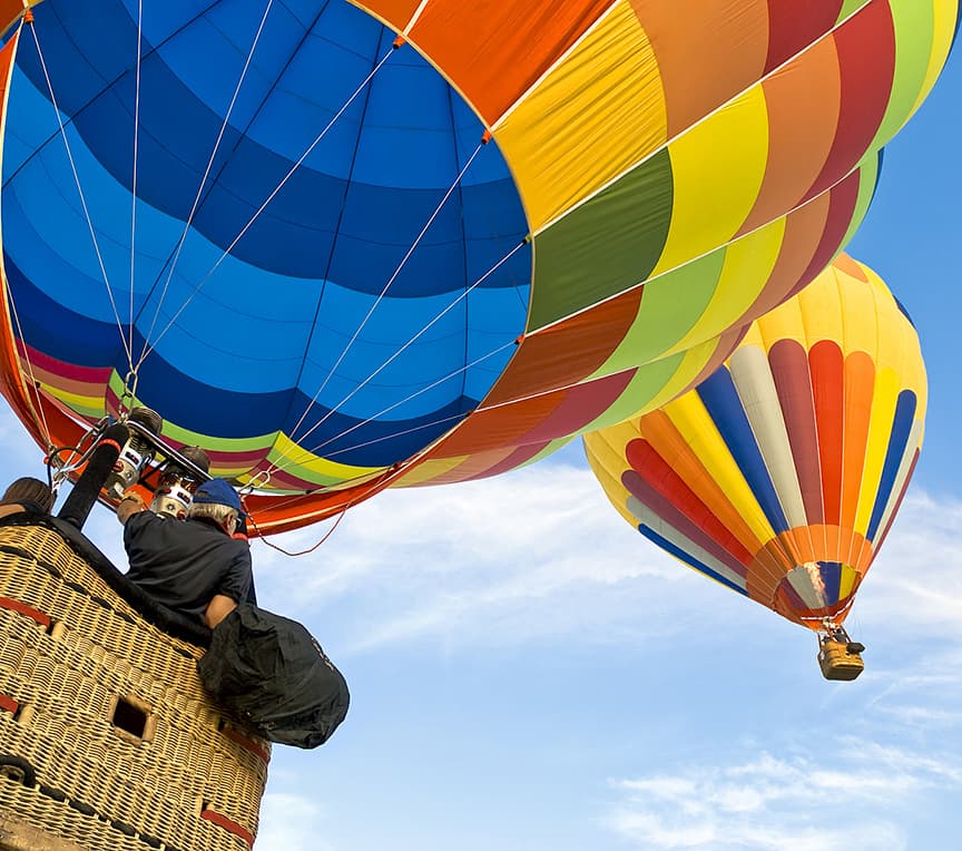 hot air balloons rising in the sky
