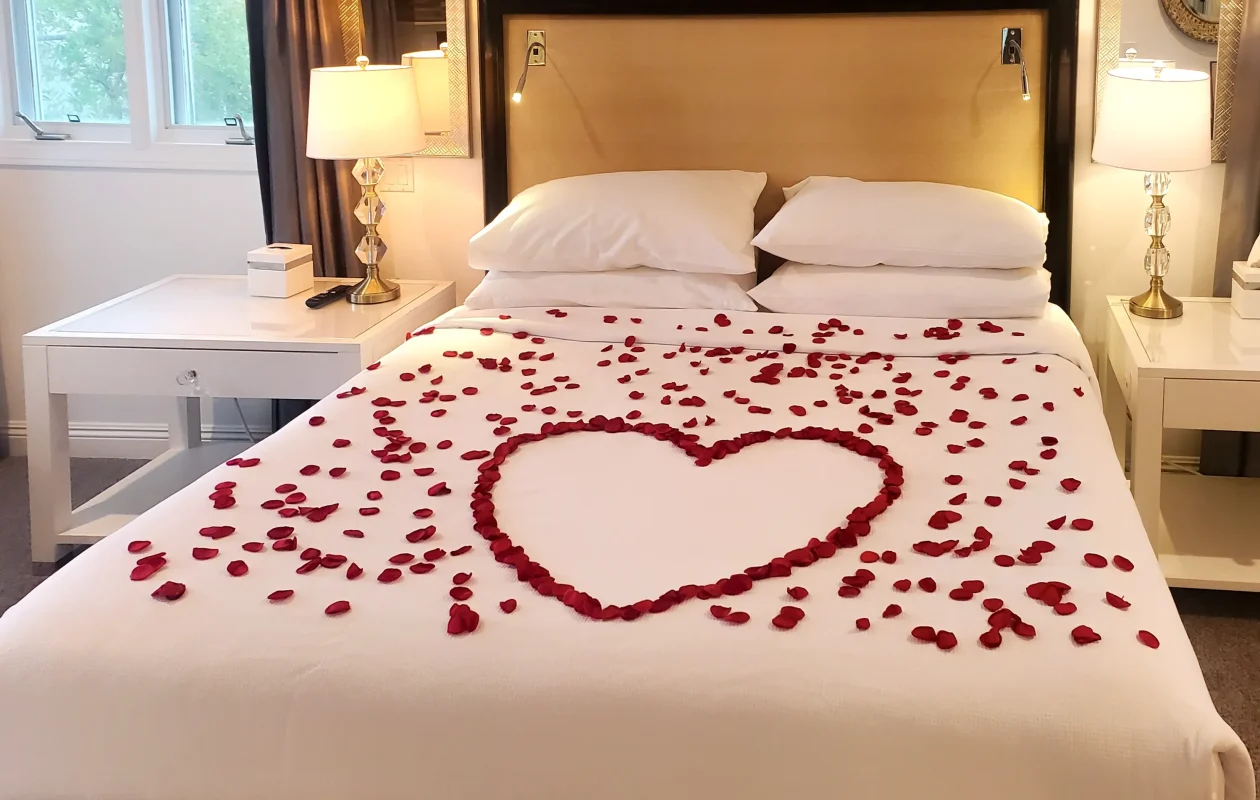 silk rose petals on the bed