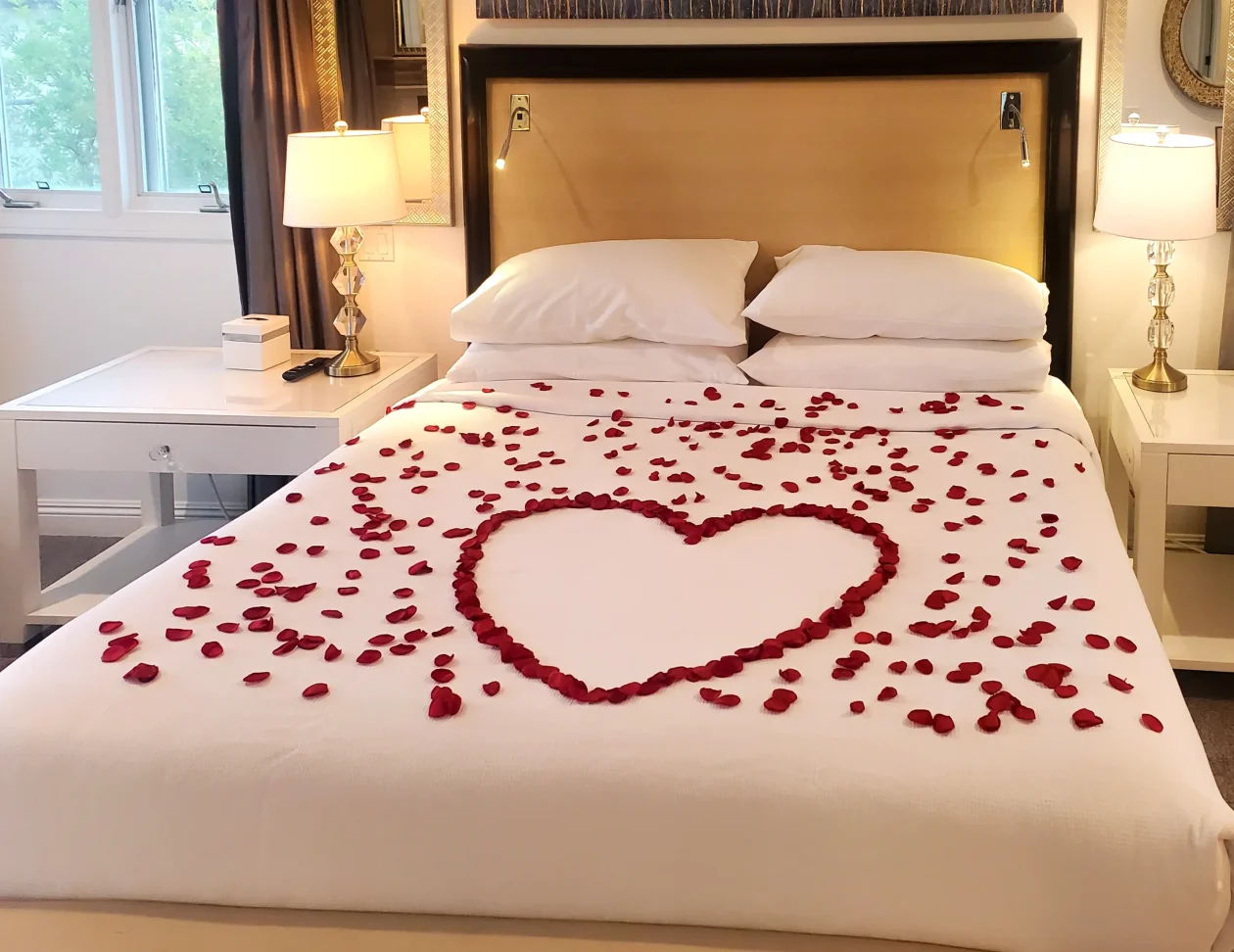 silk rose petals on the bed